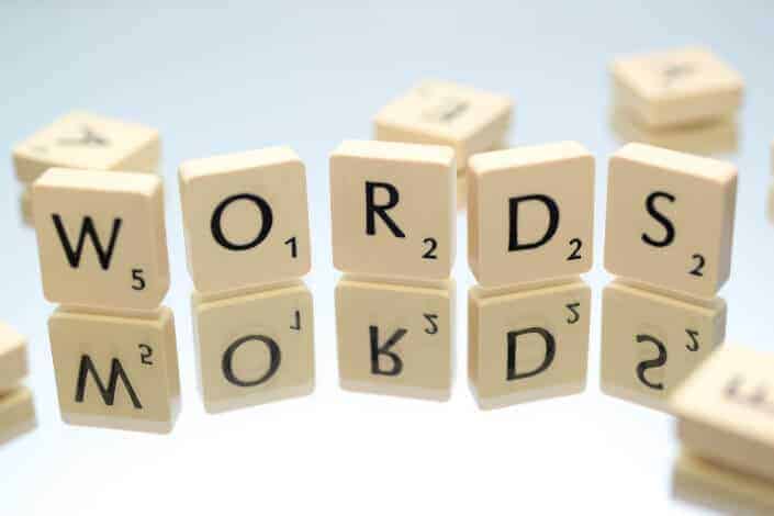 Words word on a scrabble pieces