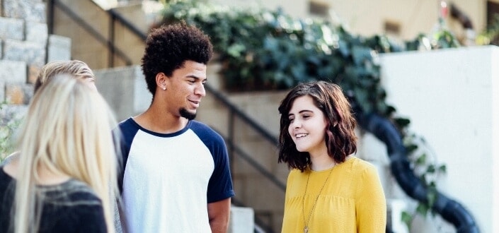 friends talking outside the building