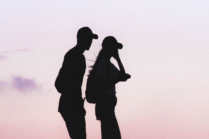 silhouette of couple walking together