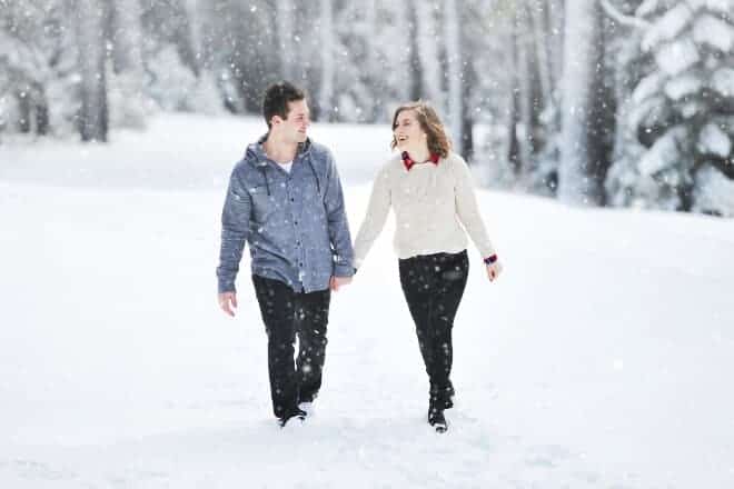 Couple walking in snow - Questions To Ask a Guy