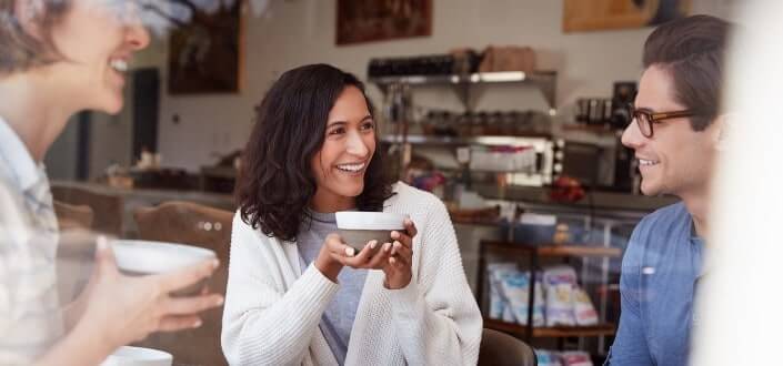 adult friends talking and drinking coffee