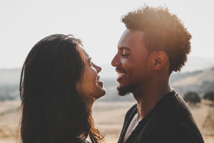 Couple facing each other and smiling
