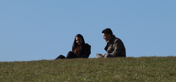 Couple sitting on grass 