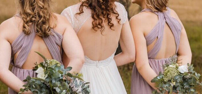 Back of Two Bridesmaids and Bride