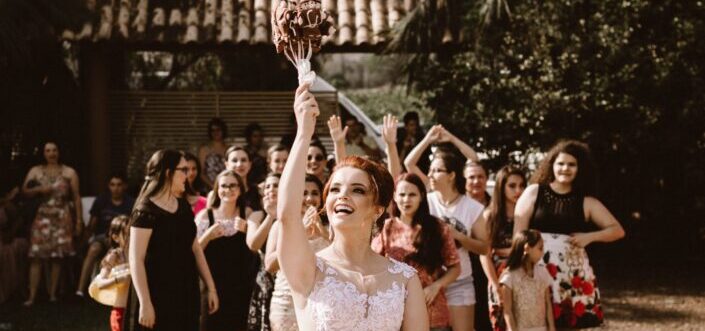 Bride Throwing Her Bouquet of Roses