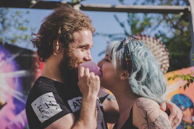 Couple happily sharing a cotton candy