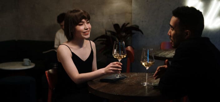 couple on a restaurant while drinking wine