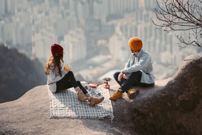 couple having a picnic on the mountain