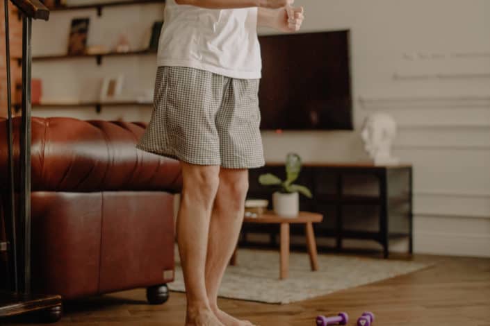 Guy Wearing Boxers Standing at Living Room