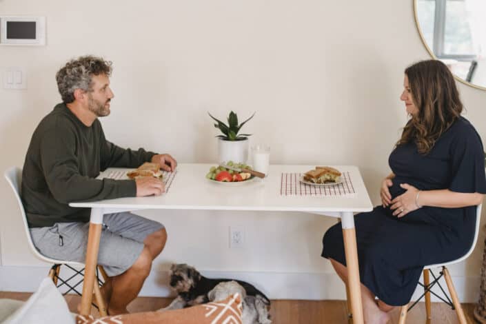 Mature couple eating lunch on dining table.