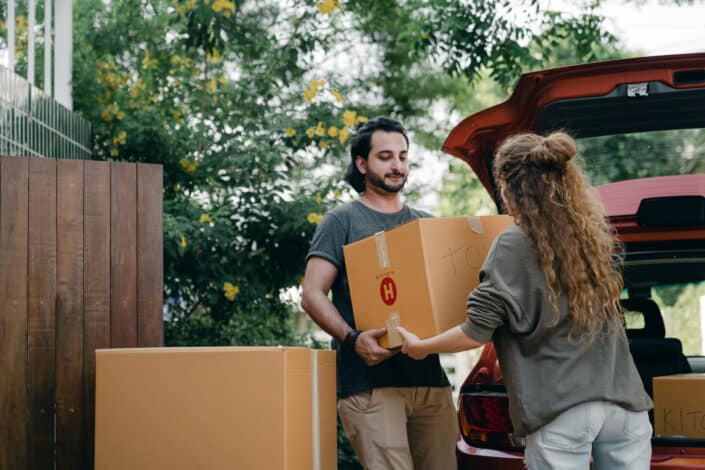 Couple unpacking car