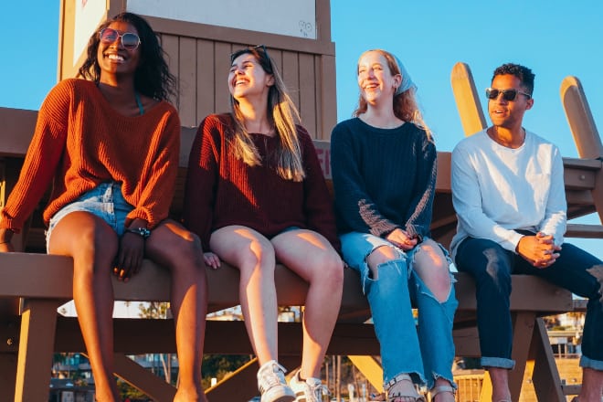 how to get out of the friend zone - friends enjoying the sunset on a lifeguard post