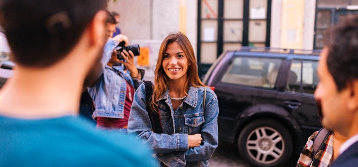 smiling woman wearing blue denim jacket