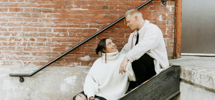 Couple sitting on staircase