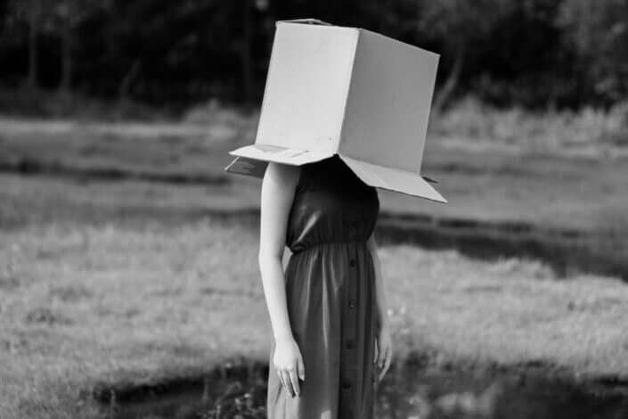 a mysterious woman with an open box in her head