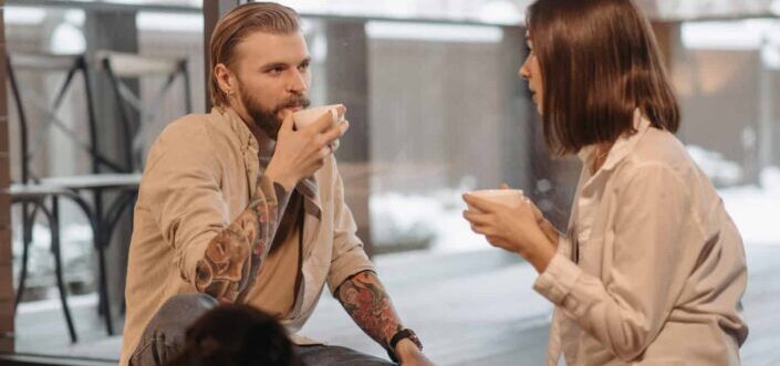 Couple having a conversation while drinking tea