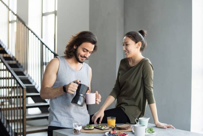 Man and woman having a breakfast together