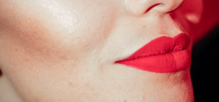 Woman with light pinkish red lipstick