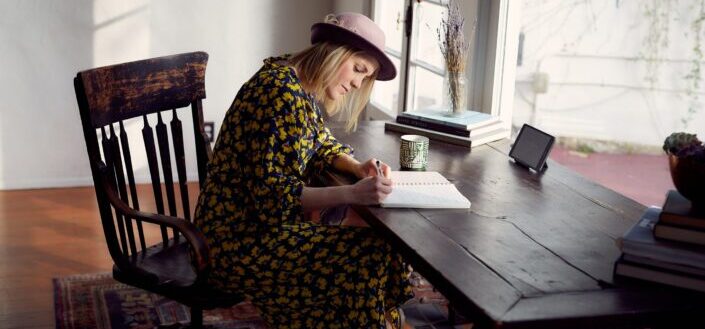 Woman writing at something