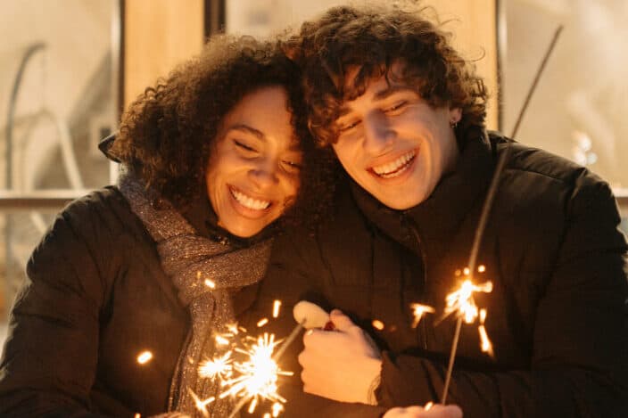 Couple enjoying the fireworks together.