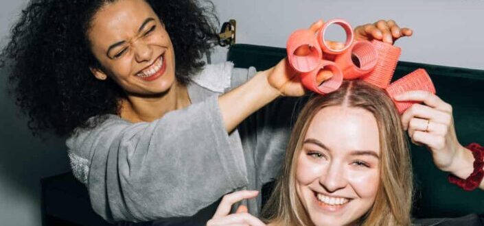 Women Putting Hair Rollers on Their Hair