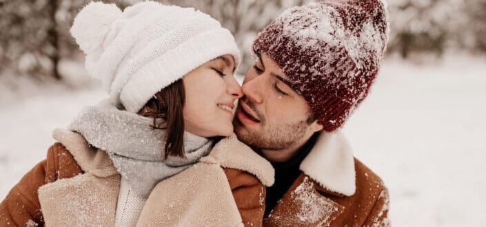 Couple kissing in the snow