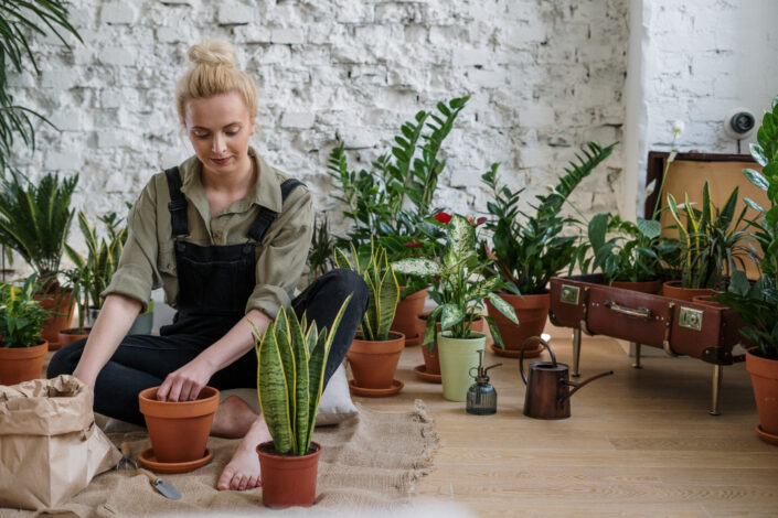 Woman Potting Plants