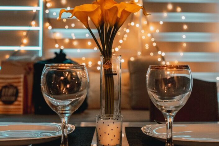 Dinner date table setup with two glasses of wine glass 
