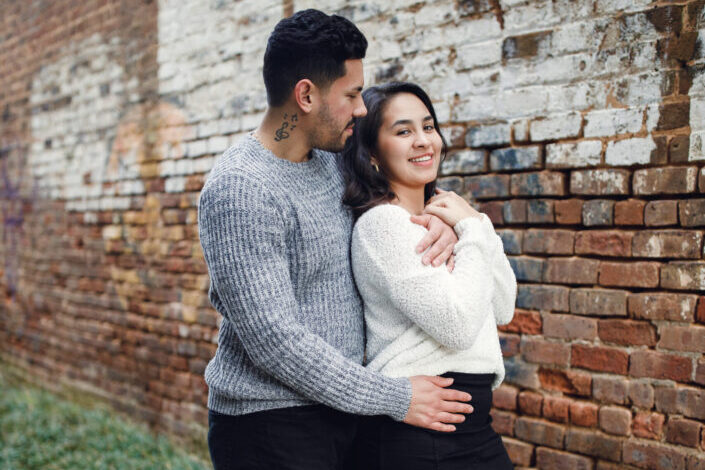 Couple on a Date Standing Beside a Wall