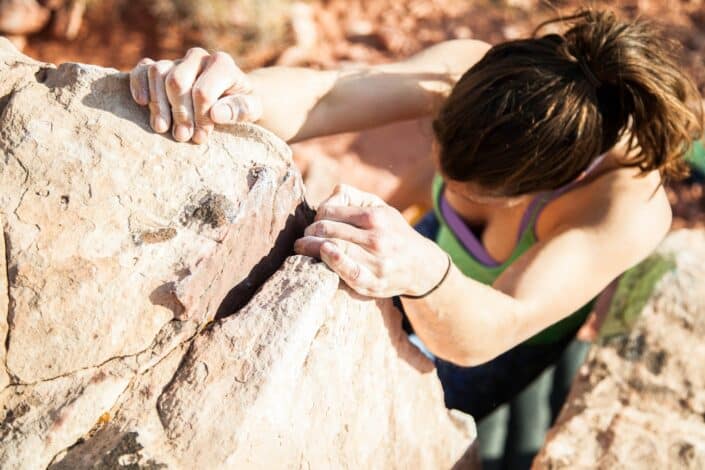 Woman Climbing Rocks