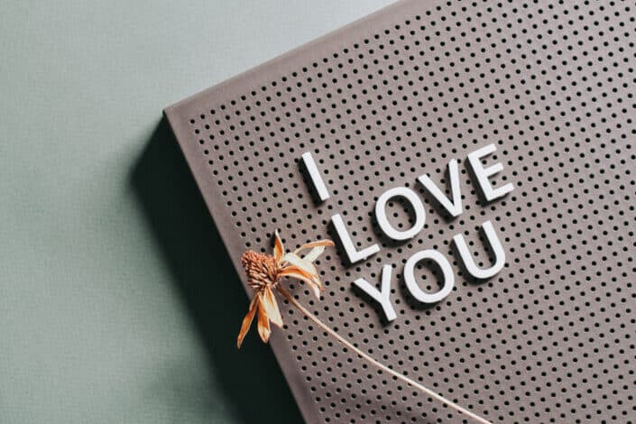 Yellow Dried Flower on a Sign Saying I Love You