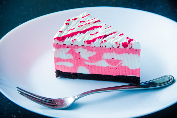 Slice of Strawberry Cake With Fork Beside