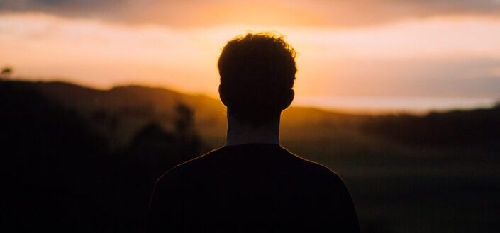 Silhouette of a Guy Watching the Sunset
