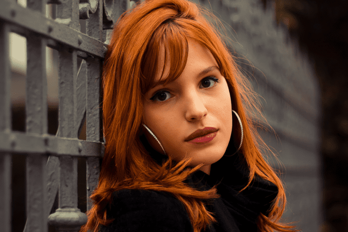 Redhead Woman Wearing Hoop Earrings