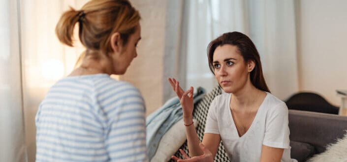 woman-in-a-white-shirt-explaining-to-a-woman-in-a-striped-shirt-stockpack-pexels