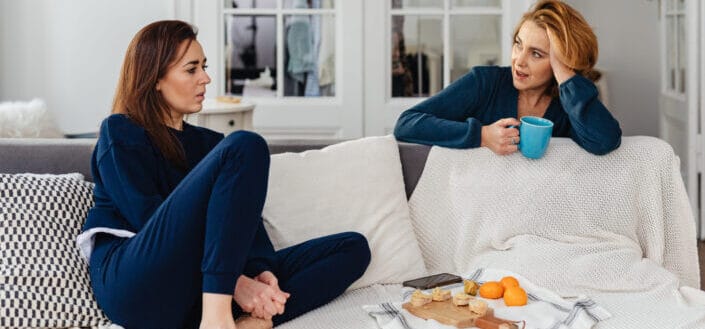 women-having-conversation-on-couch-stockpack-pexels