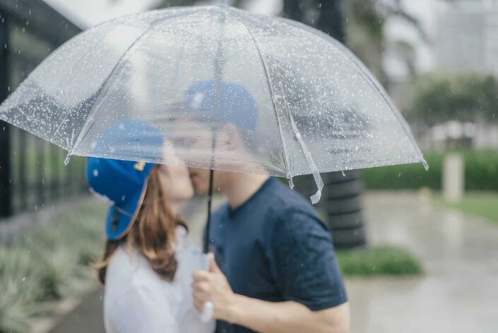 Man and woman kissing in the rain