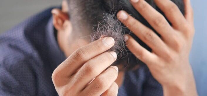 a man holding his hair