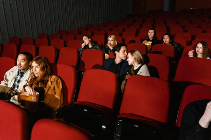 People sitting inside the cinema