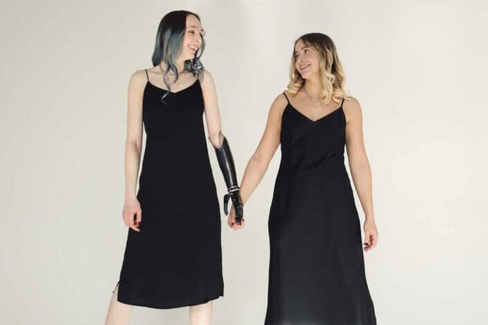 Two Girls Wearing Black Dresses 