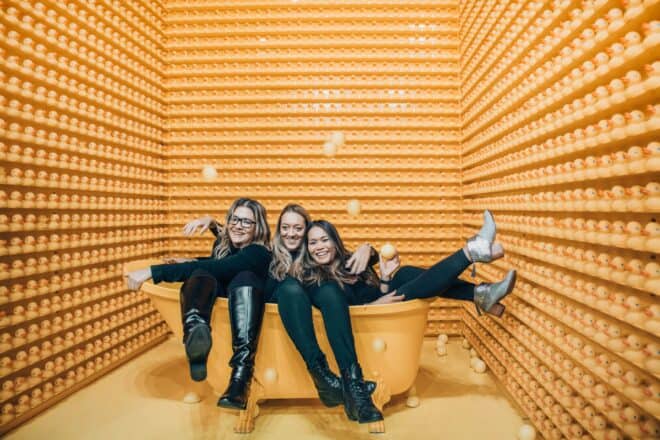 Three Girls Sitting on a Yellow Bath Tub Having Fun - Things to Call Your Best Friend