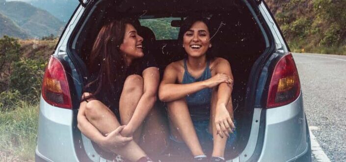 Women Laughing in the Back of Their Car