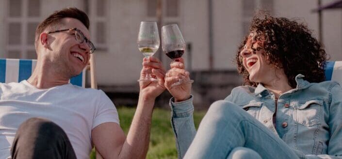 a couple drinking wine together