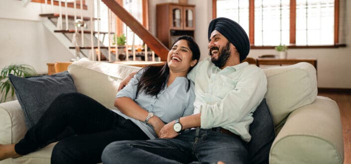 couple watching comedy movie together at home