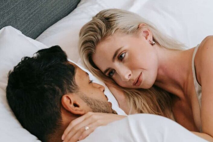 Man Admiring Woman in Bed