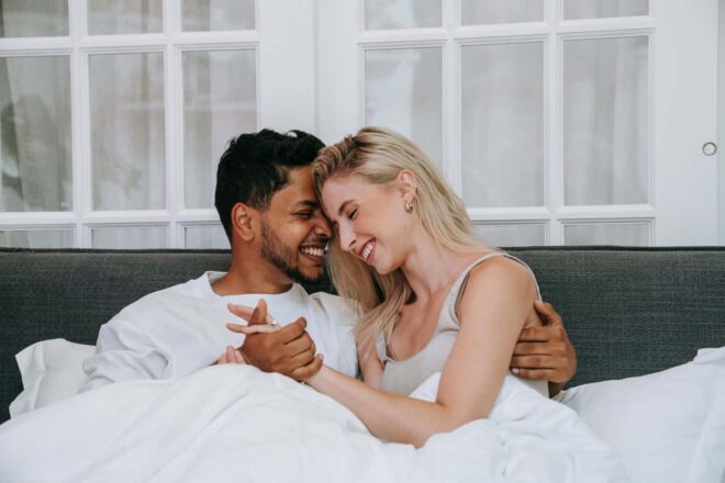 Couple Cuddling in Bed - Freaky Questions to Ask Your Boyfriend