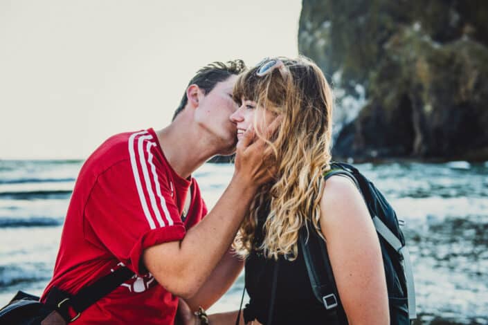 man kissing his girlfriend