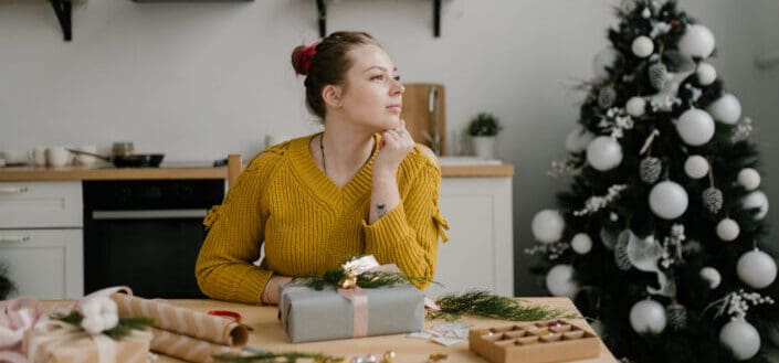 Woman in Yellow Sweater Making Christmas Decorations