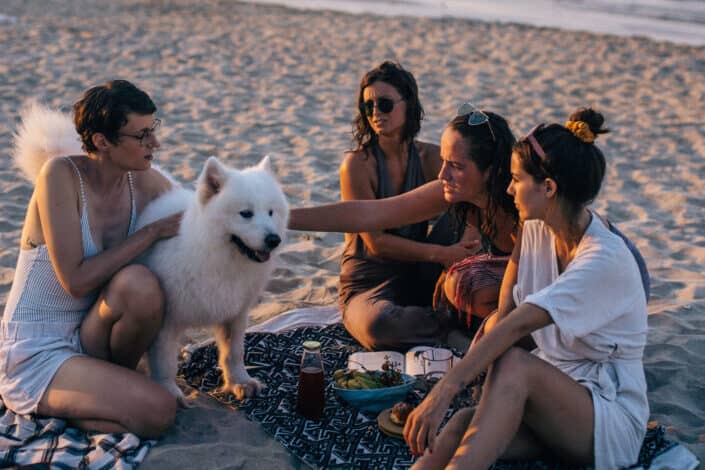 group of people with their pet dog