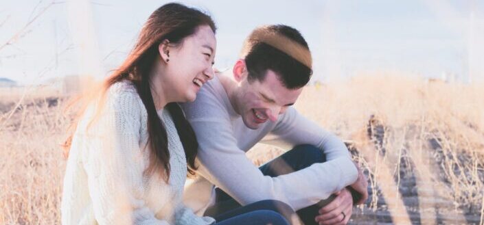 happy young couple laughing together
